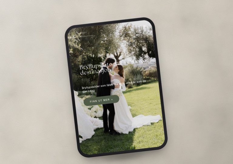 Tablet displaying wedding photography website with bride and groom